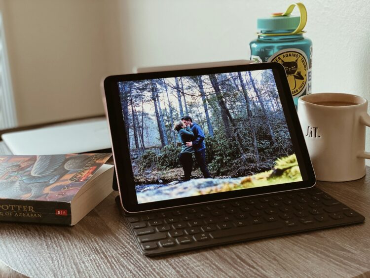black ipad with keyboard on white table