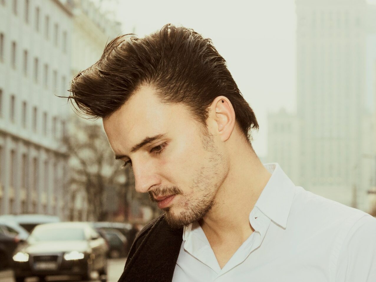 a man in a white shirt and a black jacket