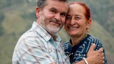 a man and a woman hugging each other