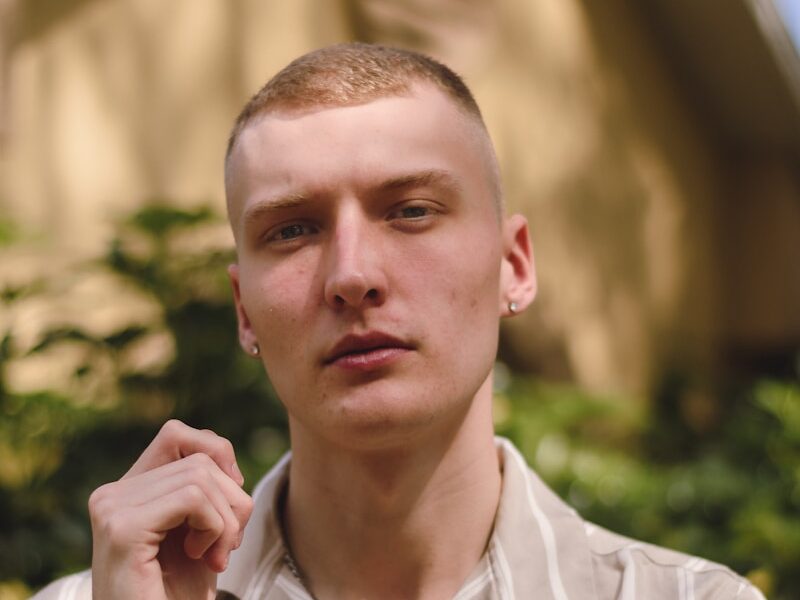 a man in a shirt is posing for a picture