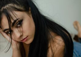 a woman with her eyes closed