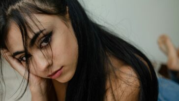 a woman with her eyes closed