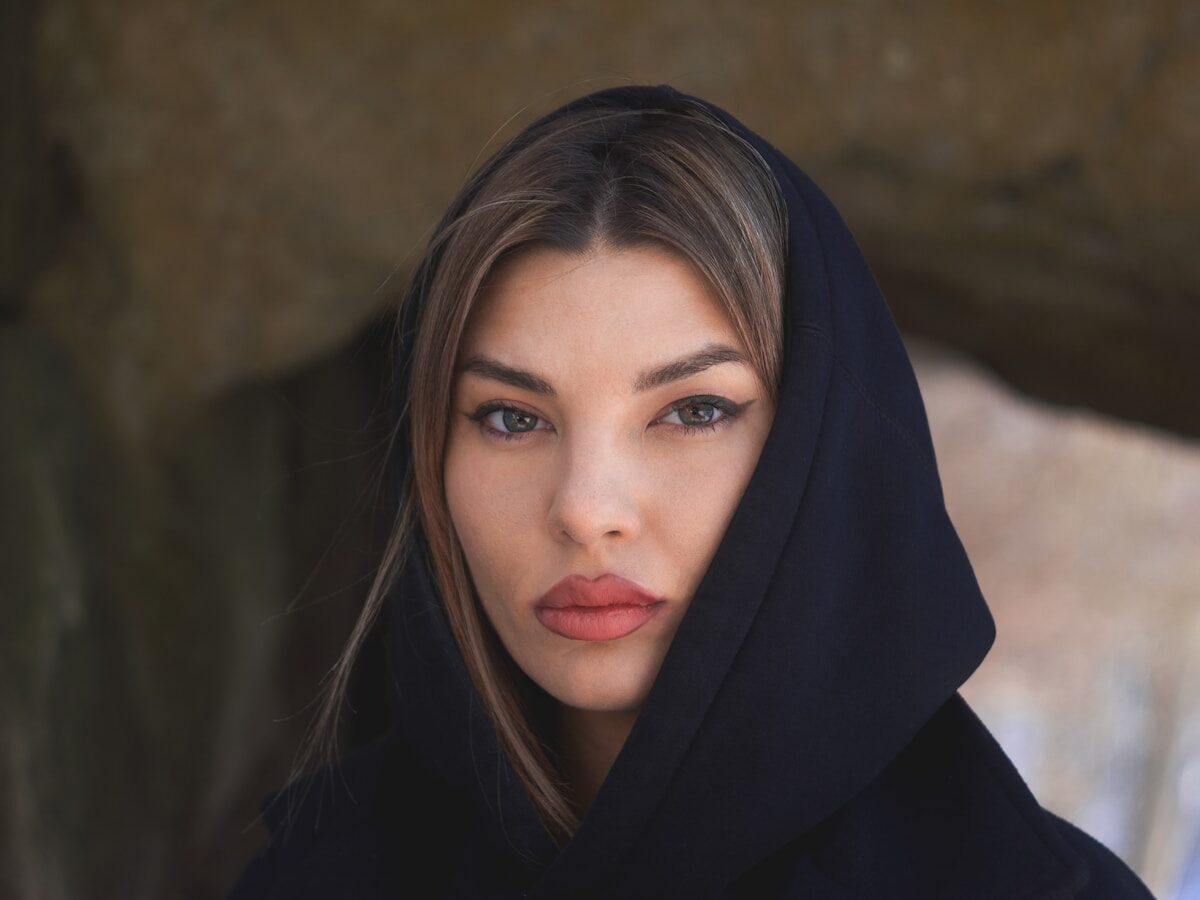 a woman wearing a black hoodie