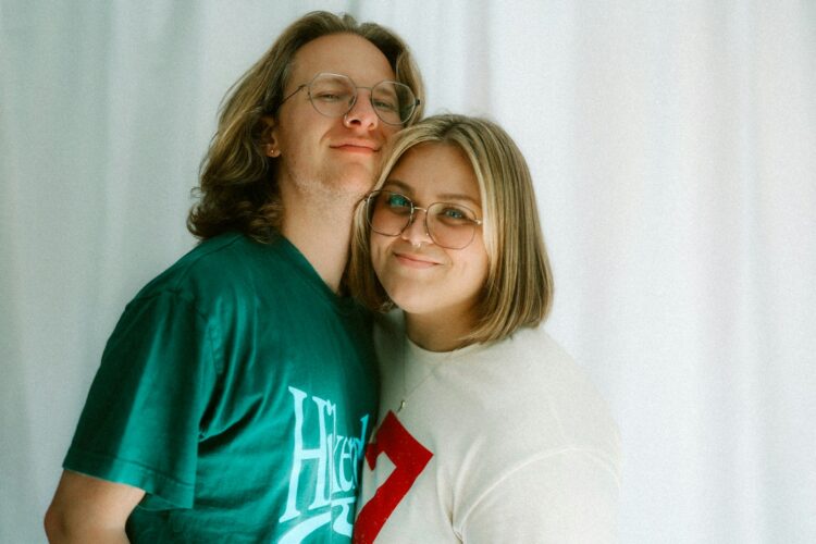 Two people smiling together.