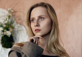 Beautiful woman poses thoughtfully in a blazer.