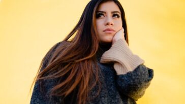 woman in brown and black sweater