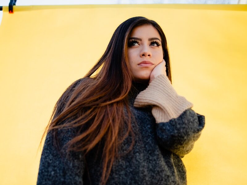 woman in brown and black sweater