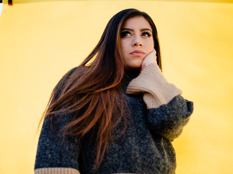 woman in brown and black sweater