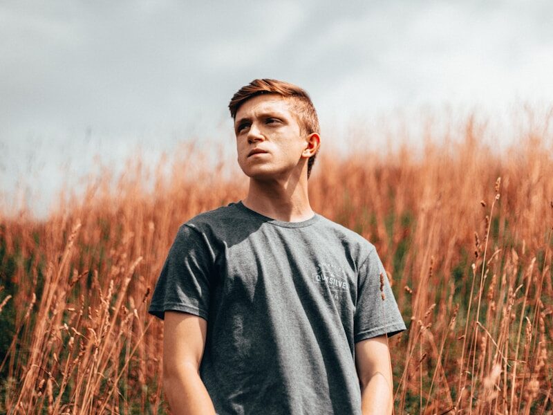 man wearing black crew-neck t-shirt