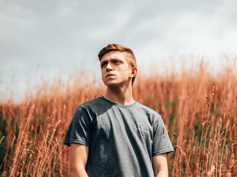 man wearing black crew-neck t-shirt