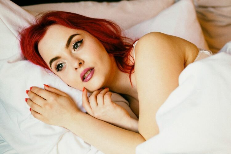 woman lying on bed