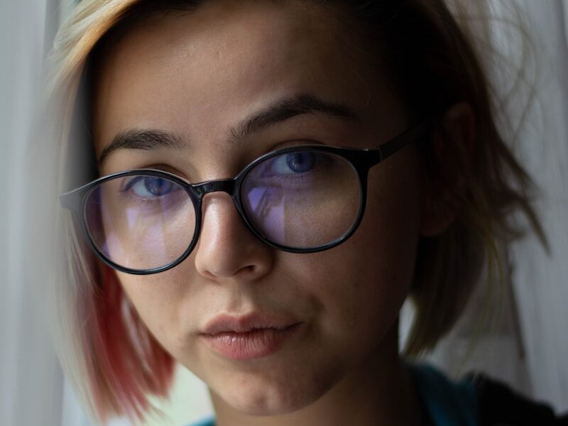 woman in black framed eyeglasses