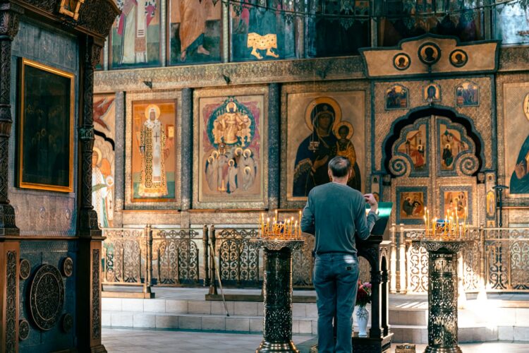 a man standing in front of a church alter