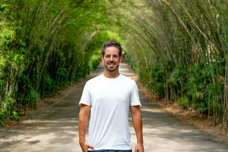 A man is standing in the middle of a road