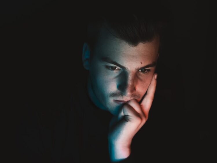 man in black shirt with blue eyes