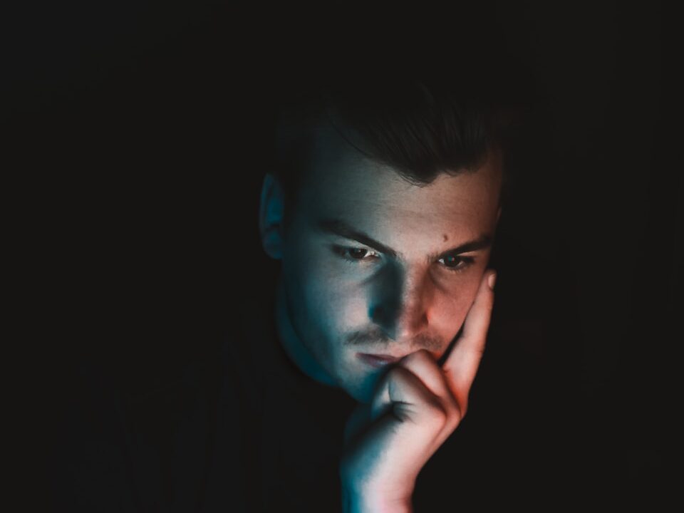 man in black shirt with blue eyes