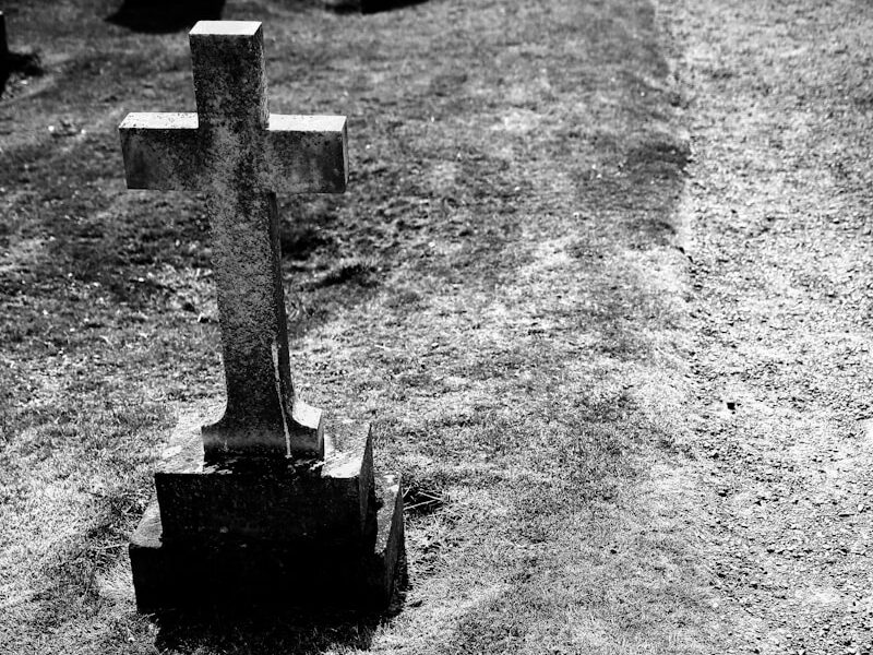 grayscale photography of gray tombstone