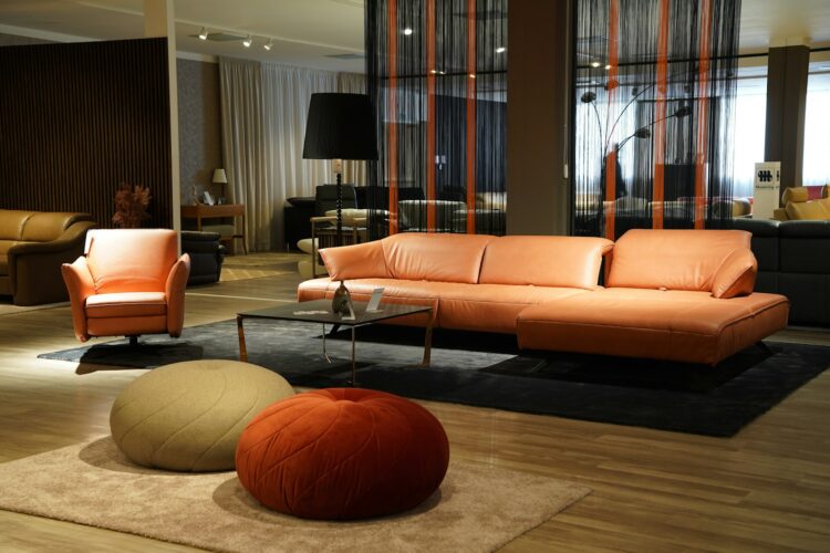 a living room filled with furniture and a large window