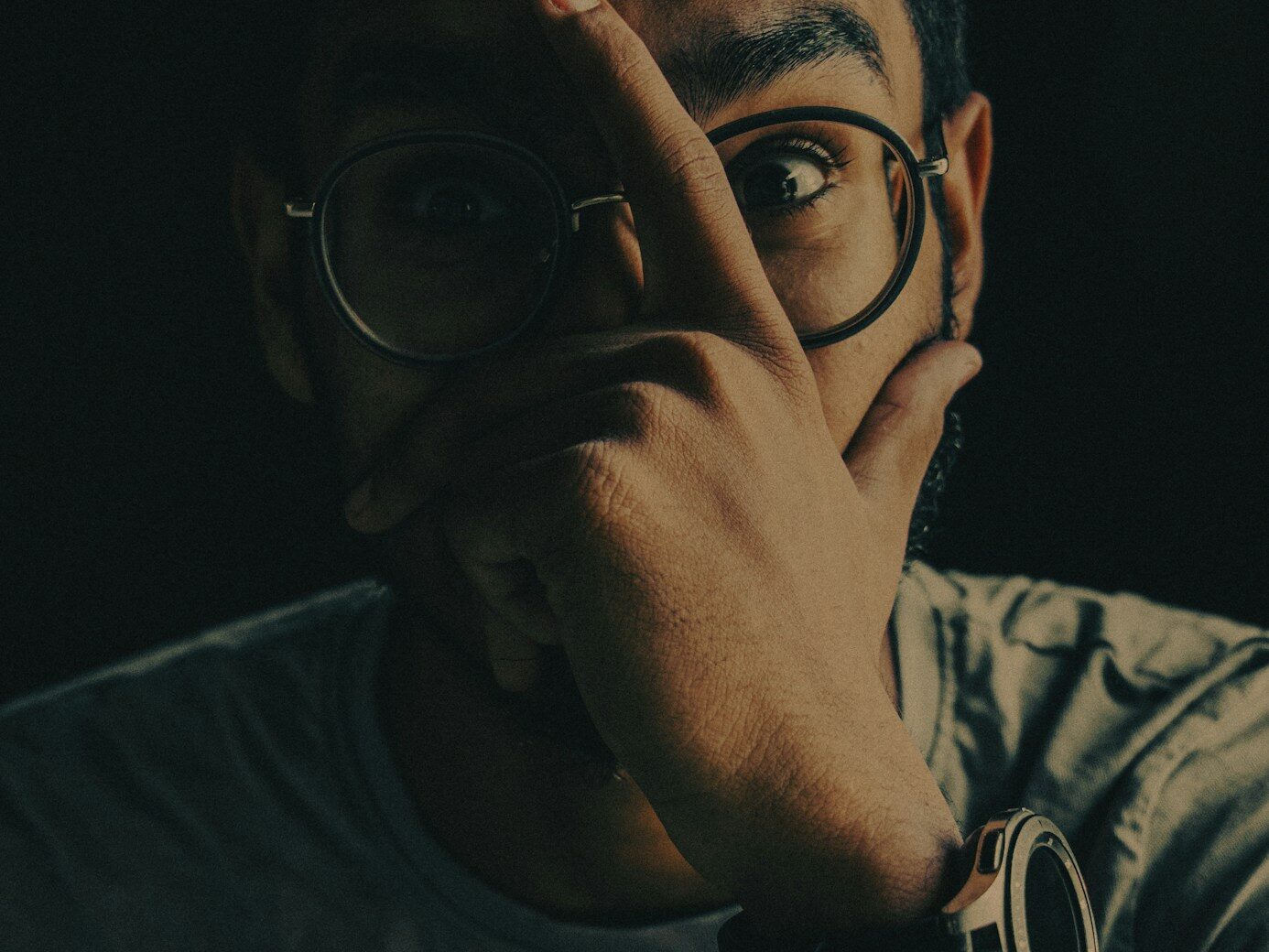 man in black framed eyeglasses