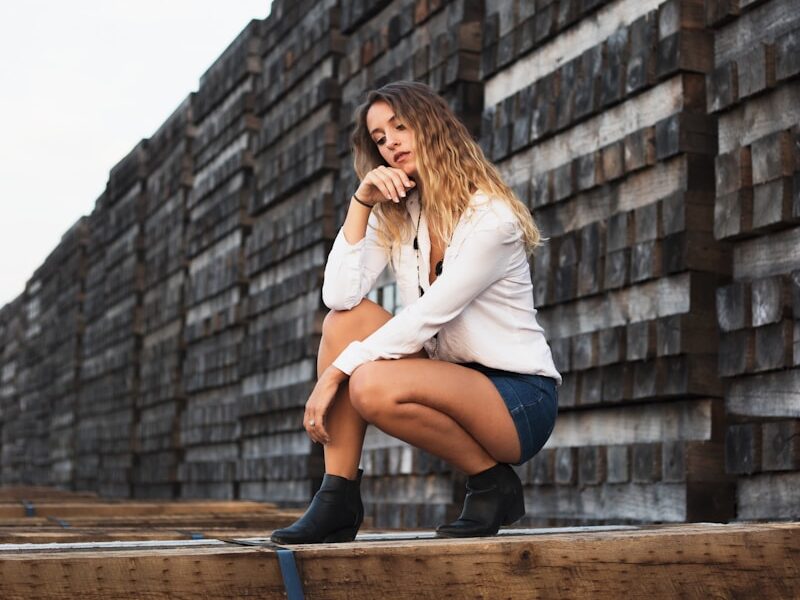 woman posting on brown platform