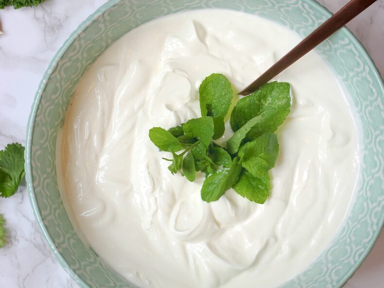 a bowl of yogurt with a spoon in it
