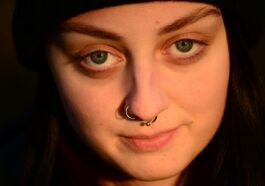 a woman with a nose piercing on her nose