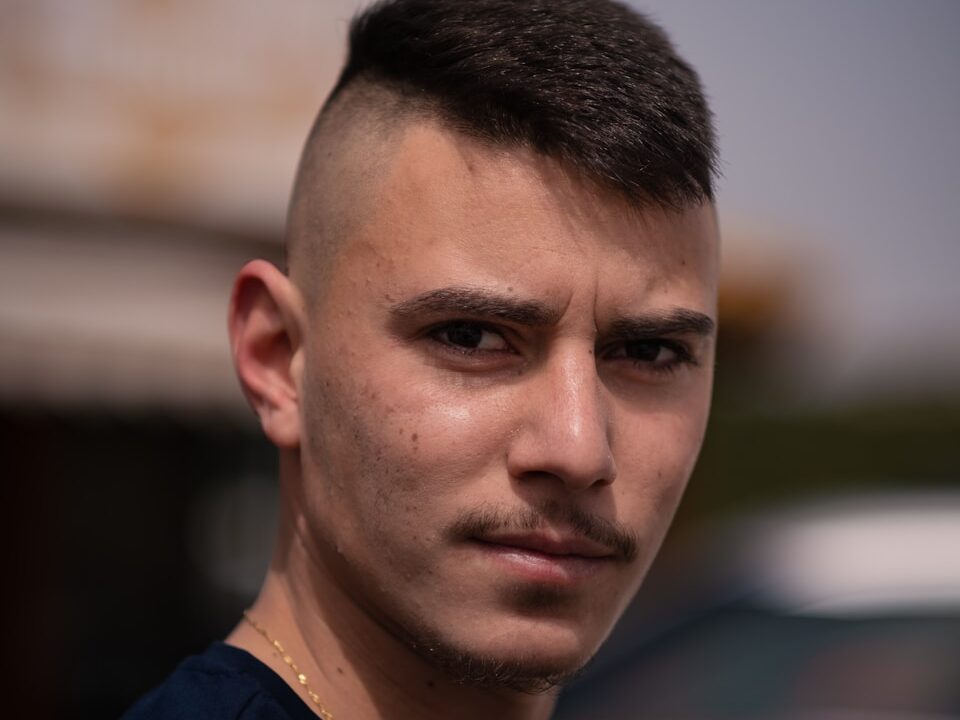 a close up of a person near a car