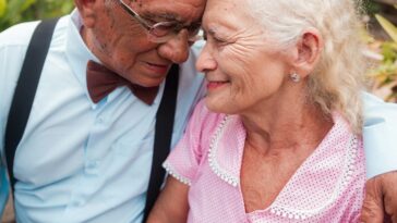 A man and a woman standing next to each other
