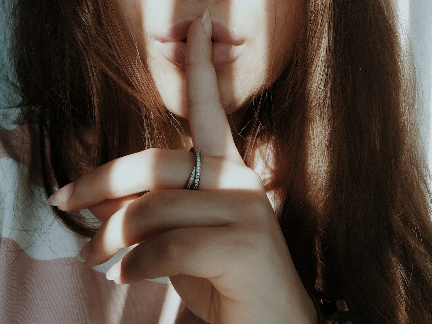 woman wearing silver ring and bracelet