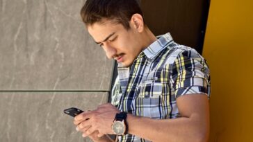 man holding Android smartphone