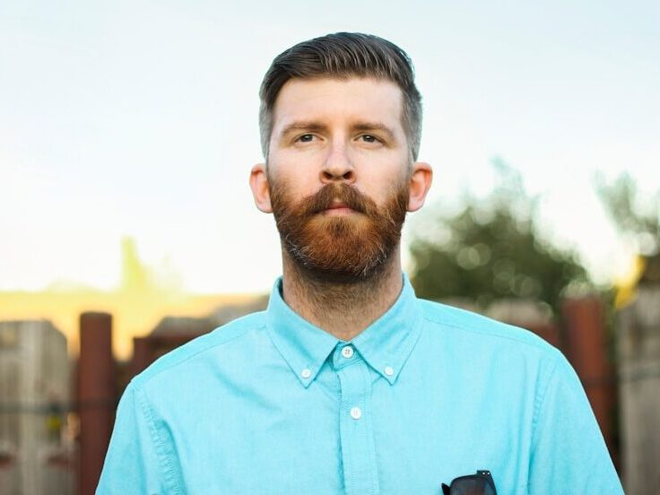 man in blue crew neck shirt