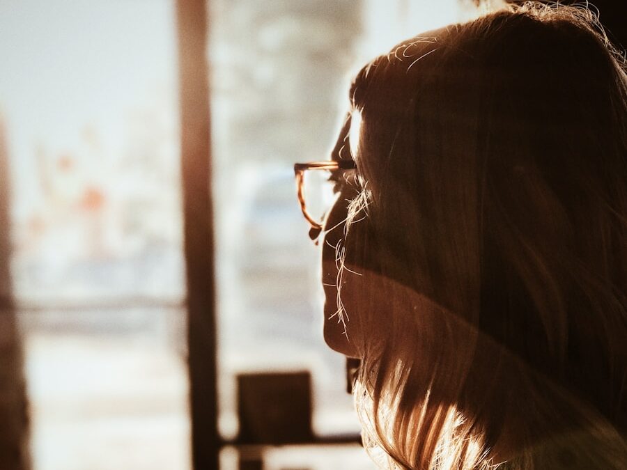 shallow focus photography of woman facing door