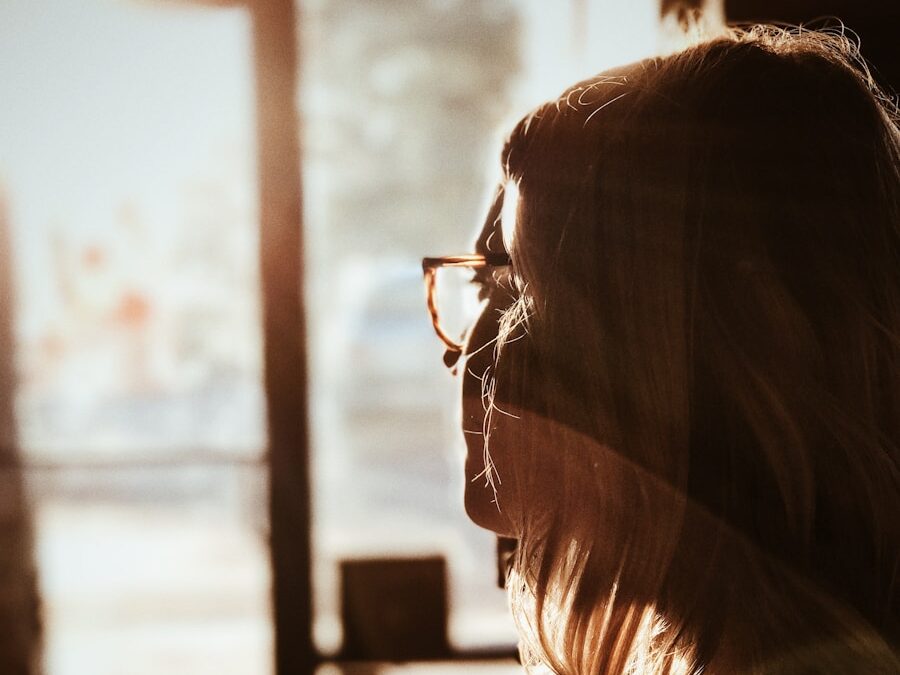 shallow focus photography of woman facing door