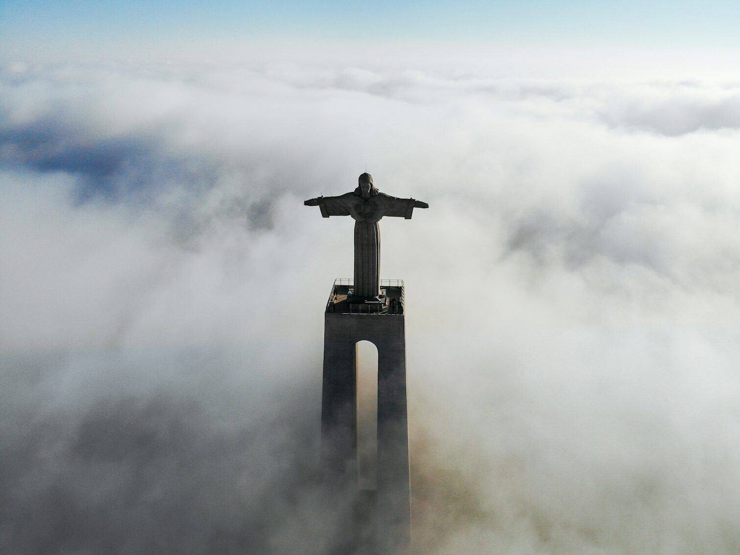 Christ Redeemer covered with clouds at daytime