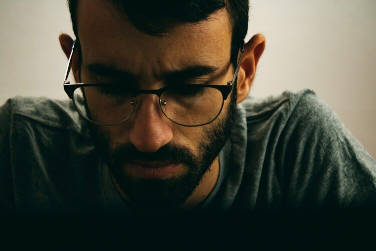 man in black framed eyeglasses