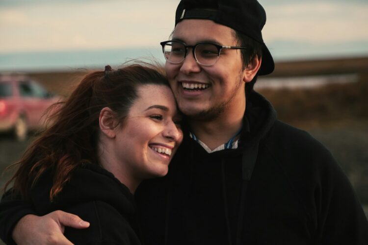 man hugging woman