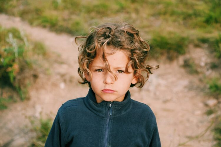 boy wearing zip-up jacket