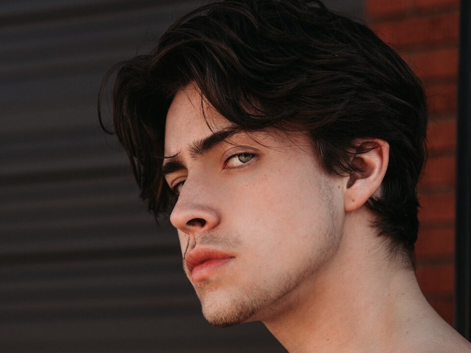 topless man with black hair