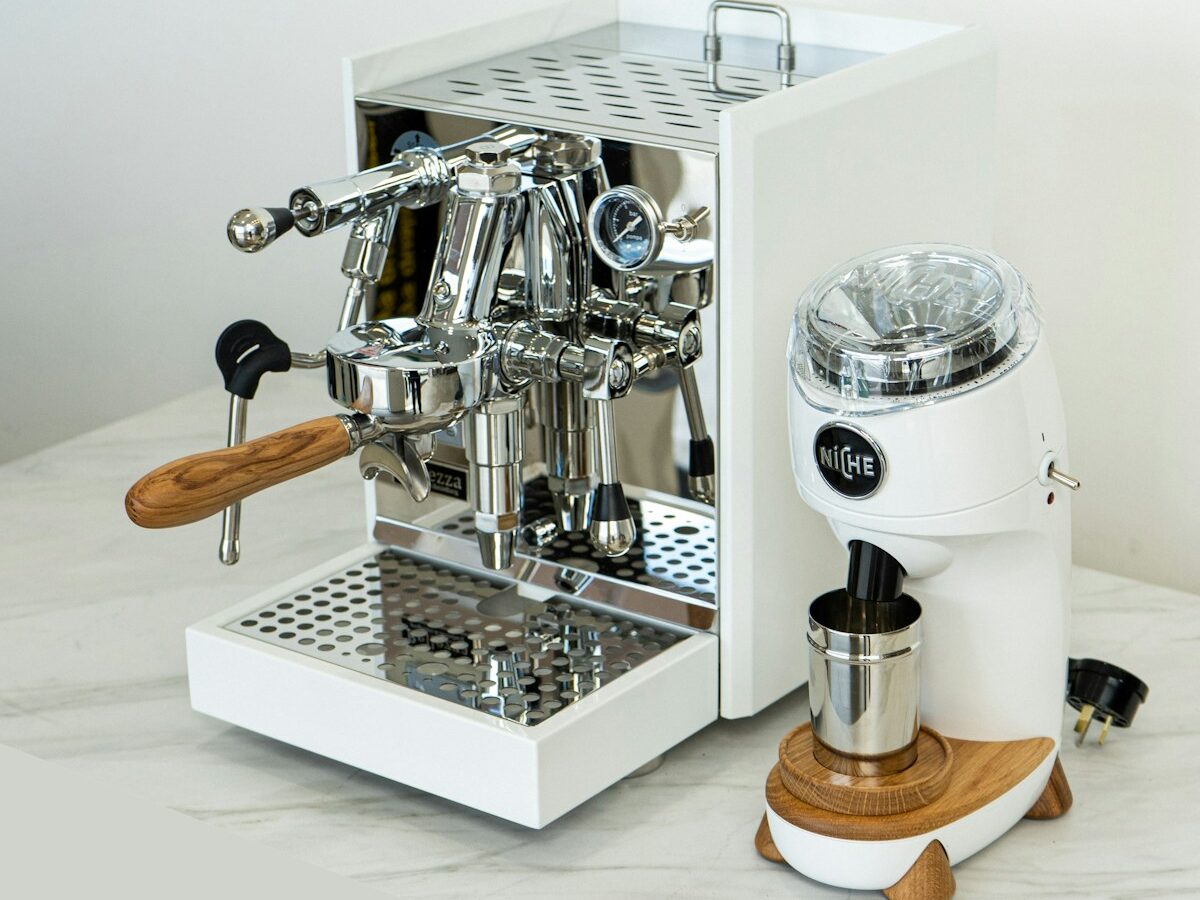 a coffee machine sitting on top of a white counter