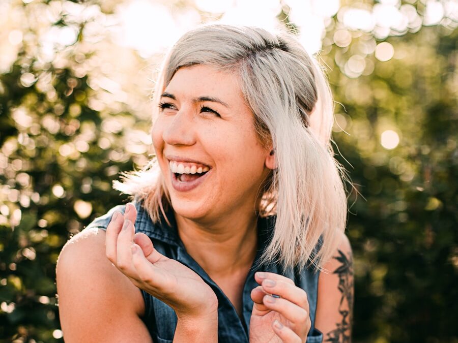woman in black tank top smiling