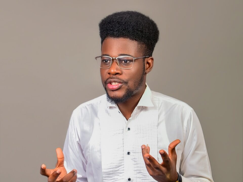 A man wearing glasses and a white shirt