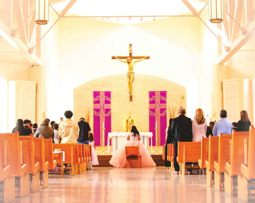 A beautiful ceremony inside a church with attendees witnessing a solemn moment.