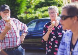 three persons near car