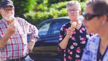 three persons near car