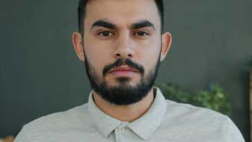 Man with beard looking directly at the camera.
