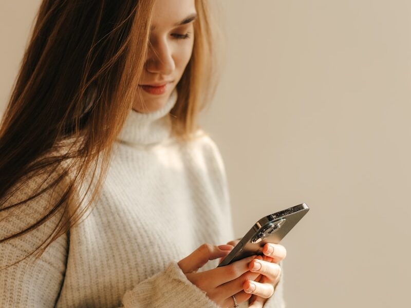 a woman looking at her phone