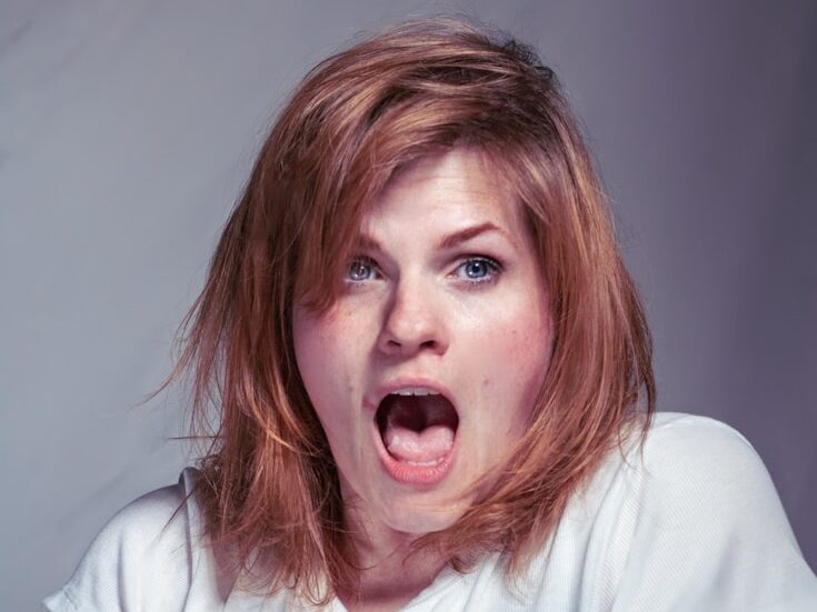 A woman with a surprised look on her face