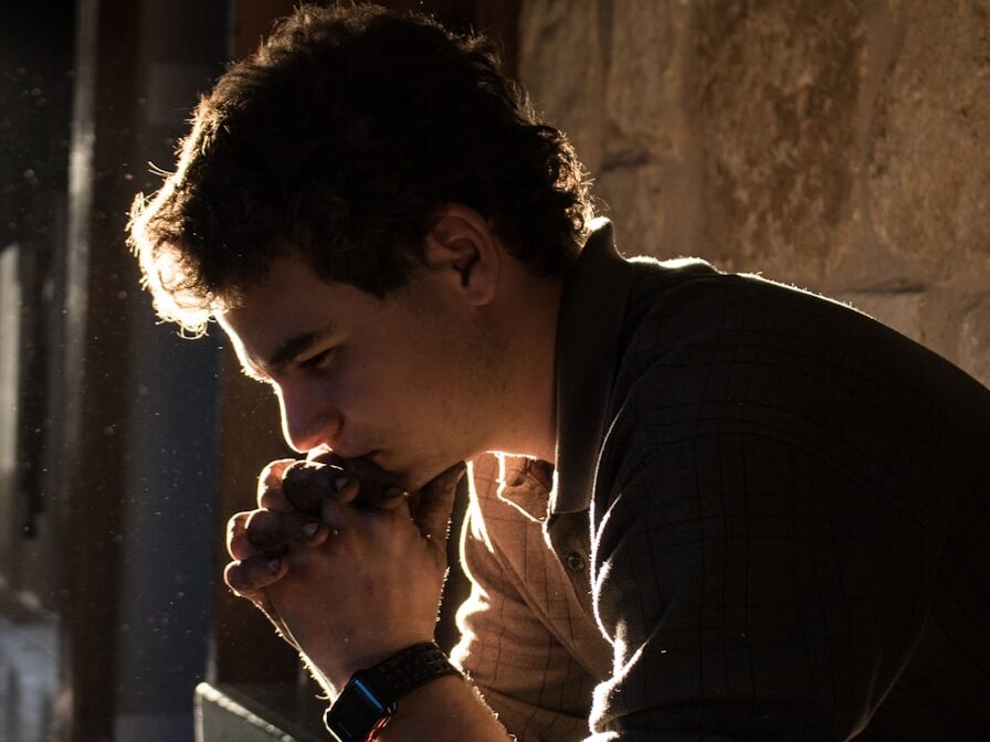 man sitting on bench