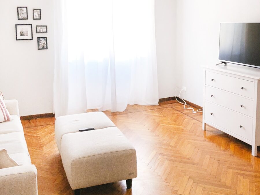 turned-off flat screen television on white dresser