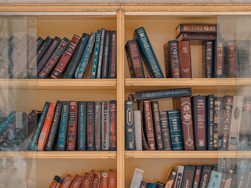 assorted-title books placed on shelf